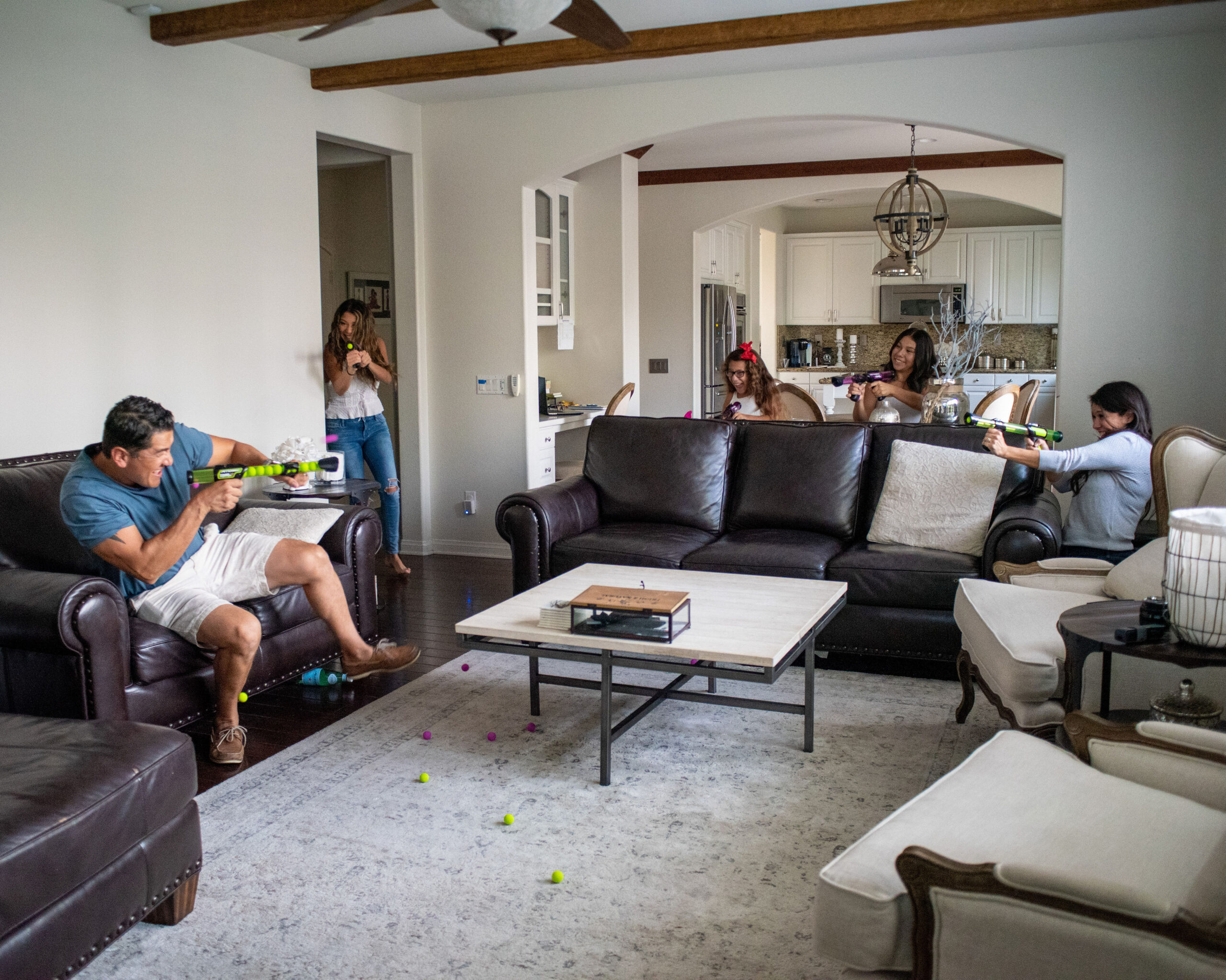 Family playing with nerf guns